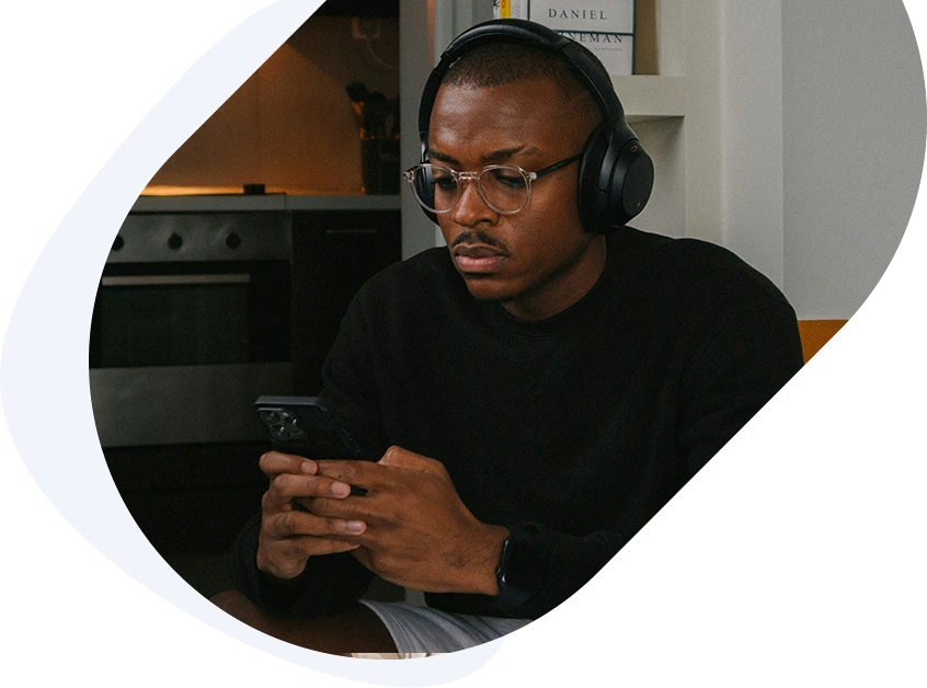 Focused man looking at his phone while applying for a ,000 fast-approval loan