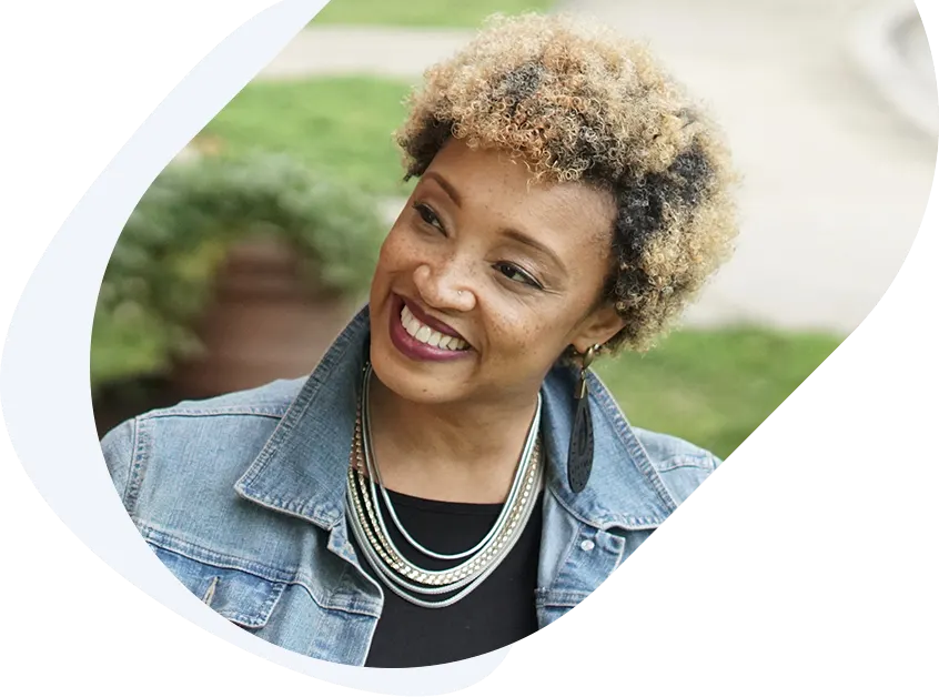 Smiling woman celebrating fast $2,500 loan approval