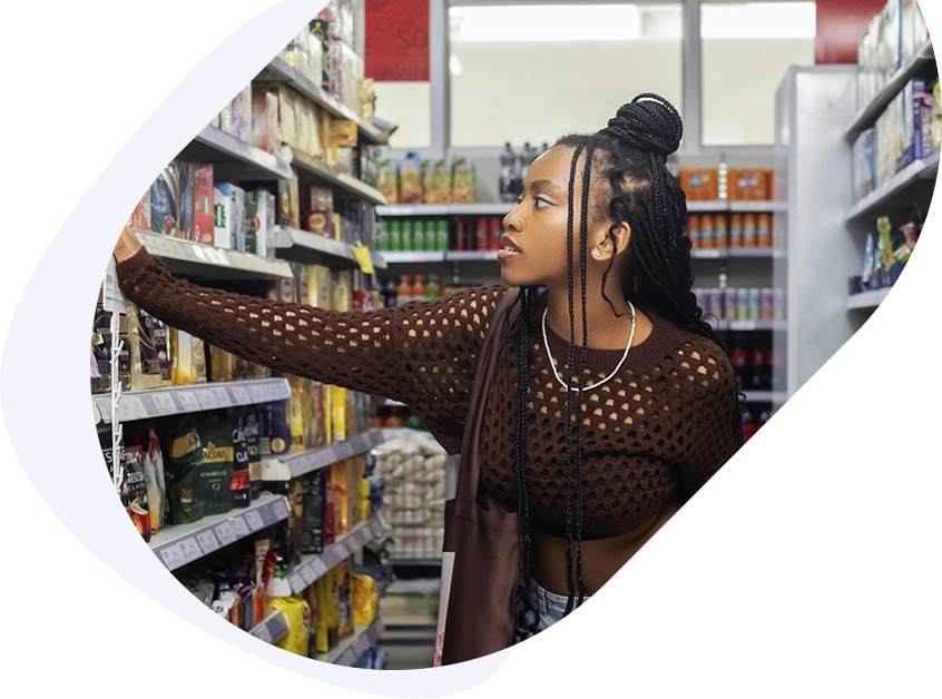 A Woman Buying Groceries Supported by a Quick $50 Loan for Urgent Needs