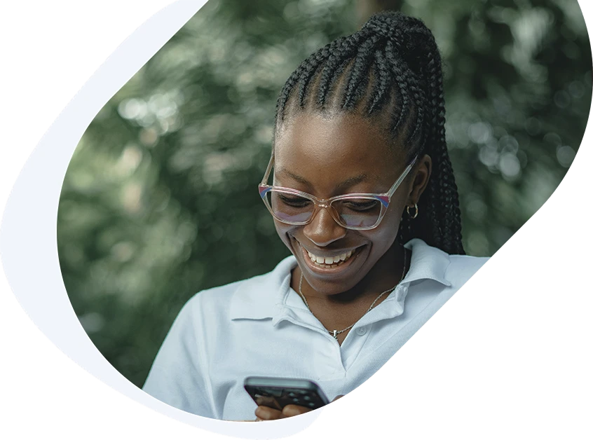 Woman receiving a message on her phone about being approved for a $700 loan