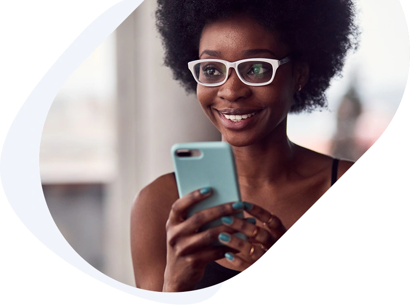 Smiling woman getting approved for a no fax payday loan on her phone