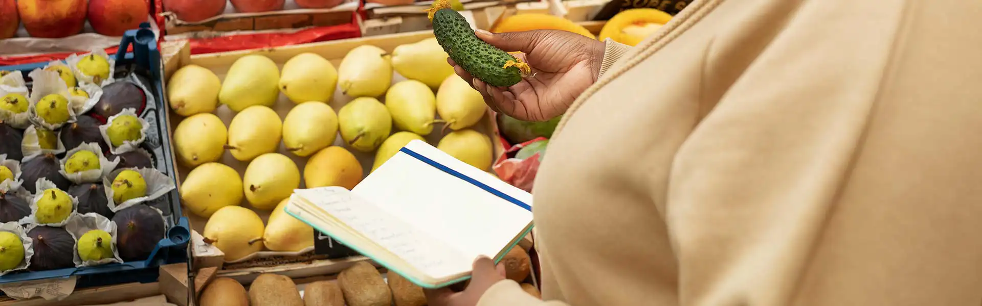 Woman shopping for vegetables while carefully managing limited funds