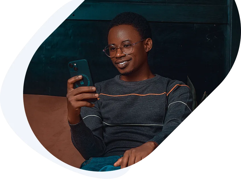 Smiling man checking his phone for same-day loan approval with no credit check